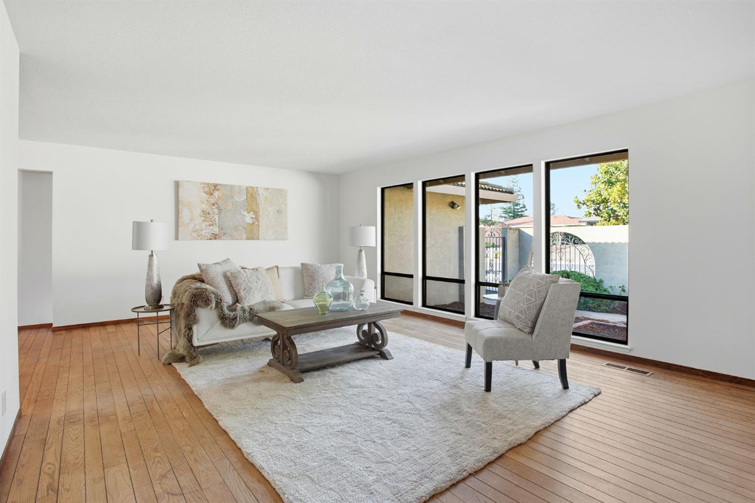 6923 Pera Drive Rancho Murieta, CA 95683 - Photo 8 of 35 a living room with furniture and a large window