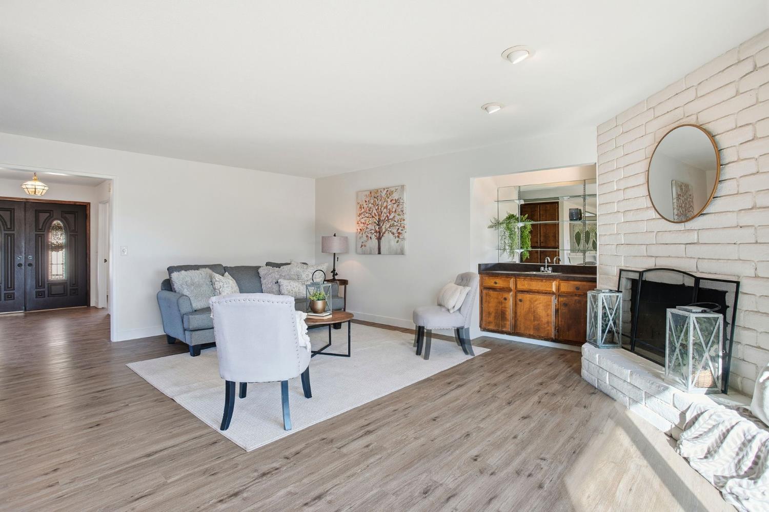 6923 Pera Drive Rancho Murieta, CA 95683 - Photo 10 of 35 a living room with furniture and a fireplace
