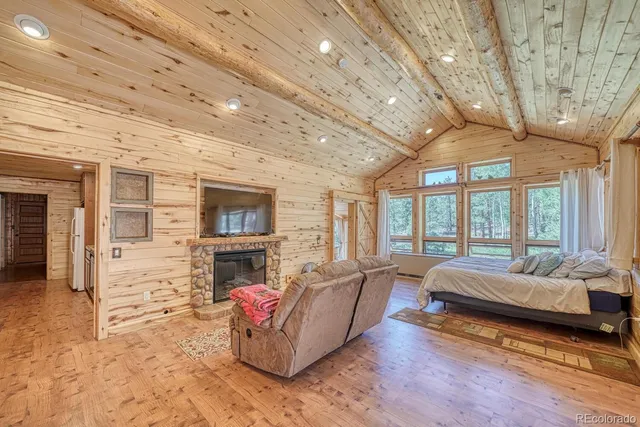 a spacious bedroom with a bed and a couch