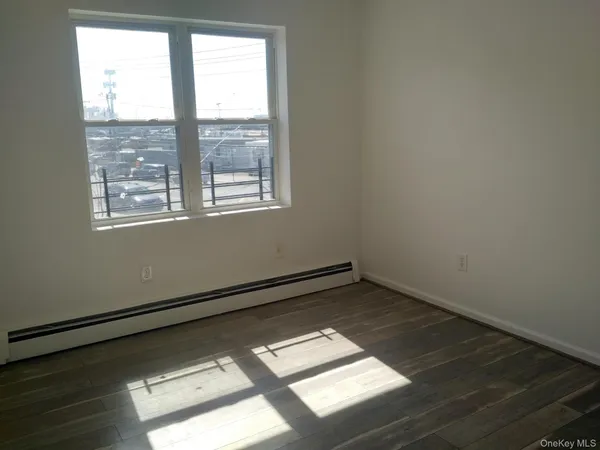 a view of an empty room and a window