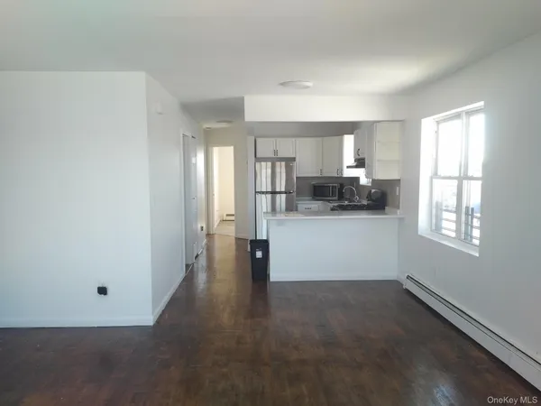 a view of a kitchen with furniture and window