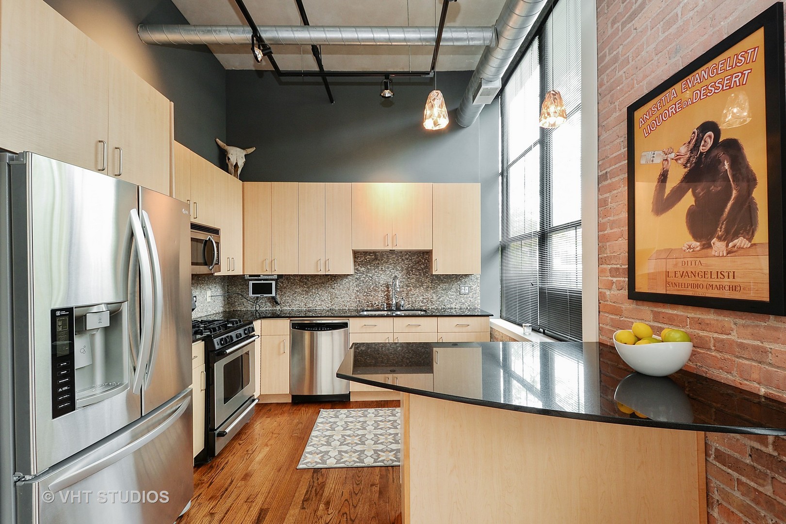 817 West Washington Boulevard, Unit 103 Chicago, IL 60607 - Photo 4 of 10 a kitchen with stainless steel appliances granite countertop a refrigerator and a stove