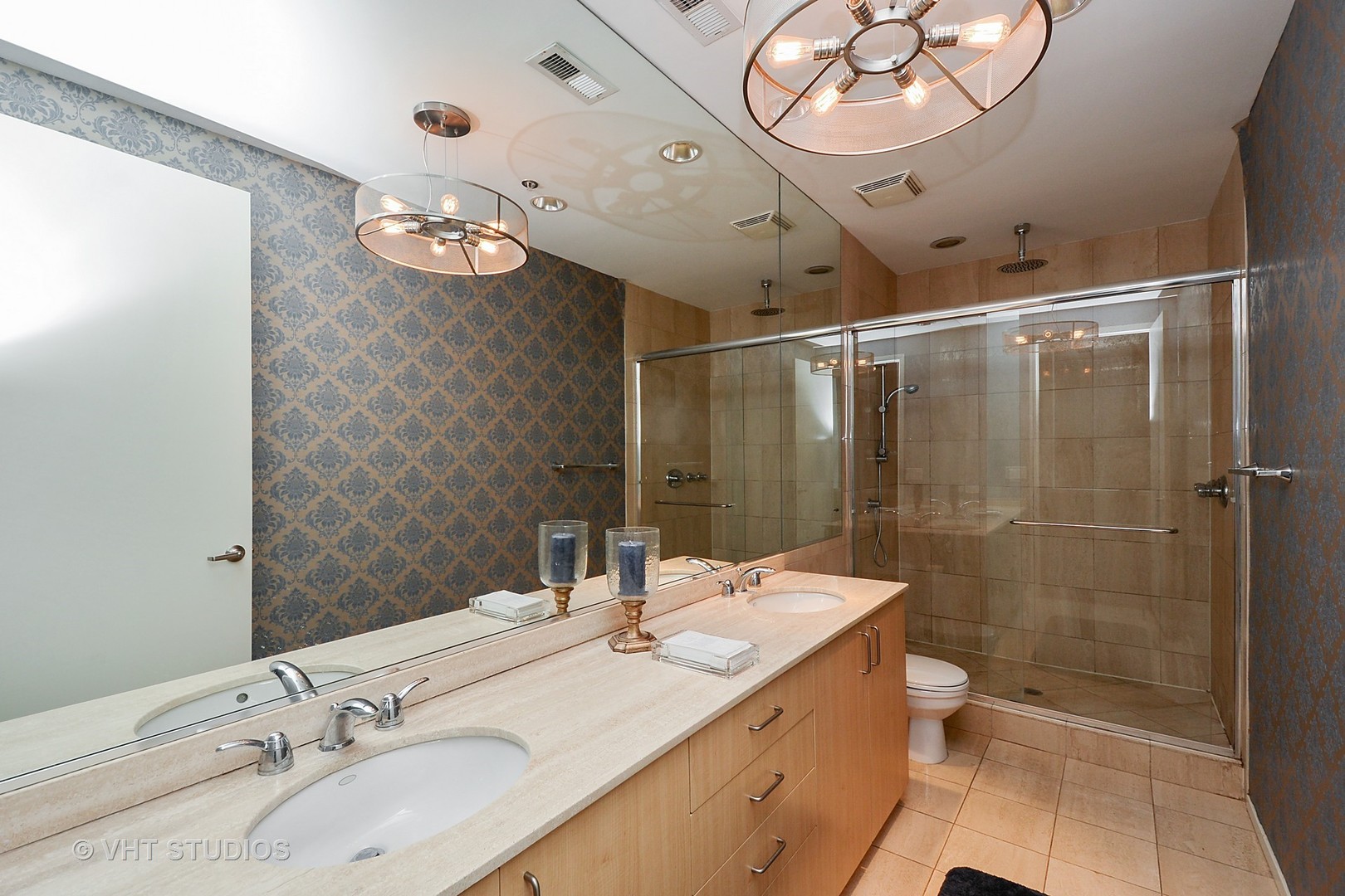 817 West Washington Boulevard, Unit 103 Chicago, IL 60607 - Photo 8 of 10 a bathroom with a double vanity sink mirror and toilet