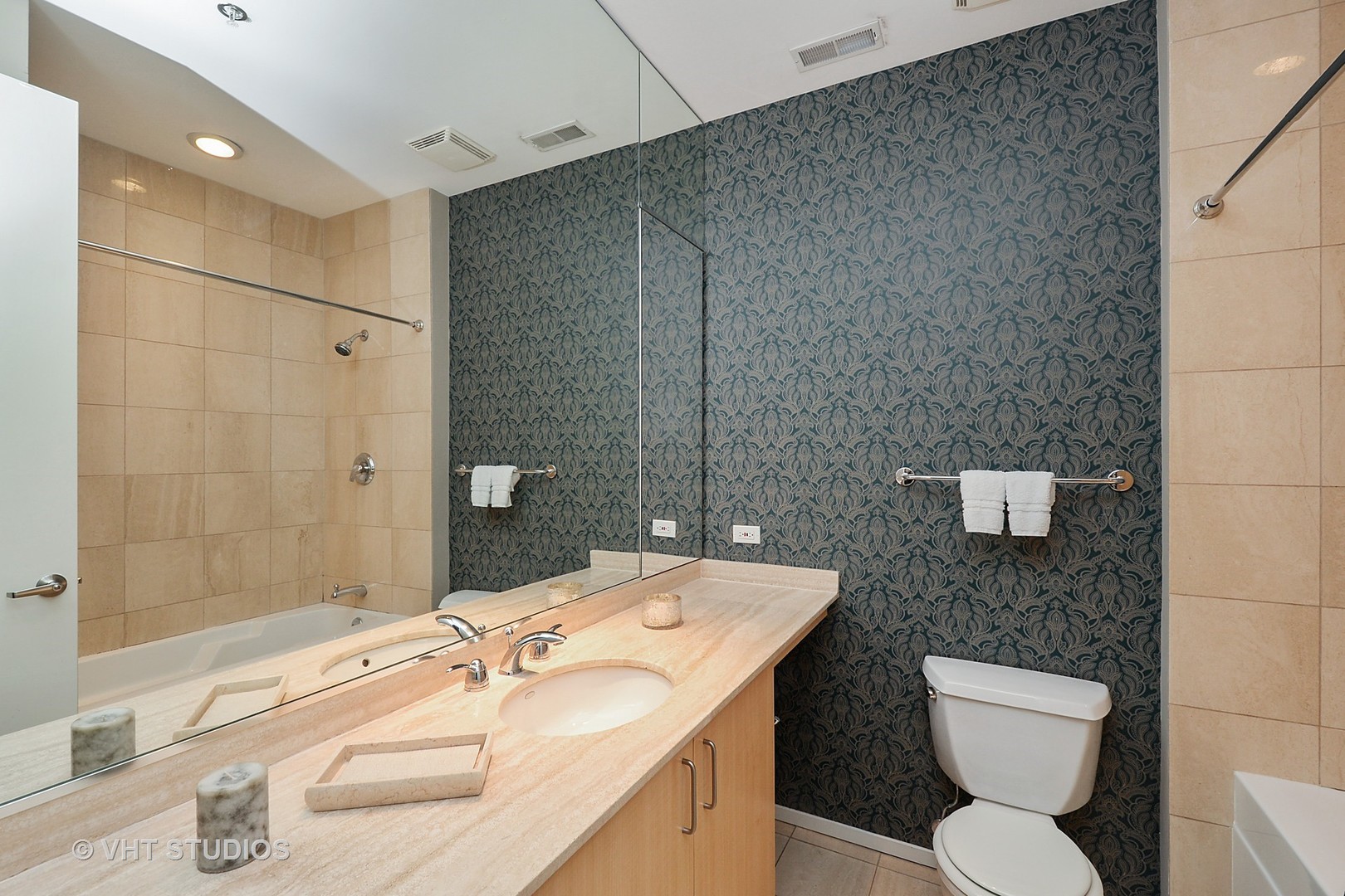 817 West Washington Boulevard, Unit 103 Chicago, IL 60607 - Photo 10 of 10 a bathroom with a sink a toilet and shower