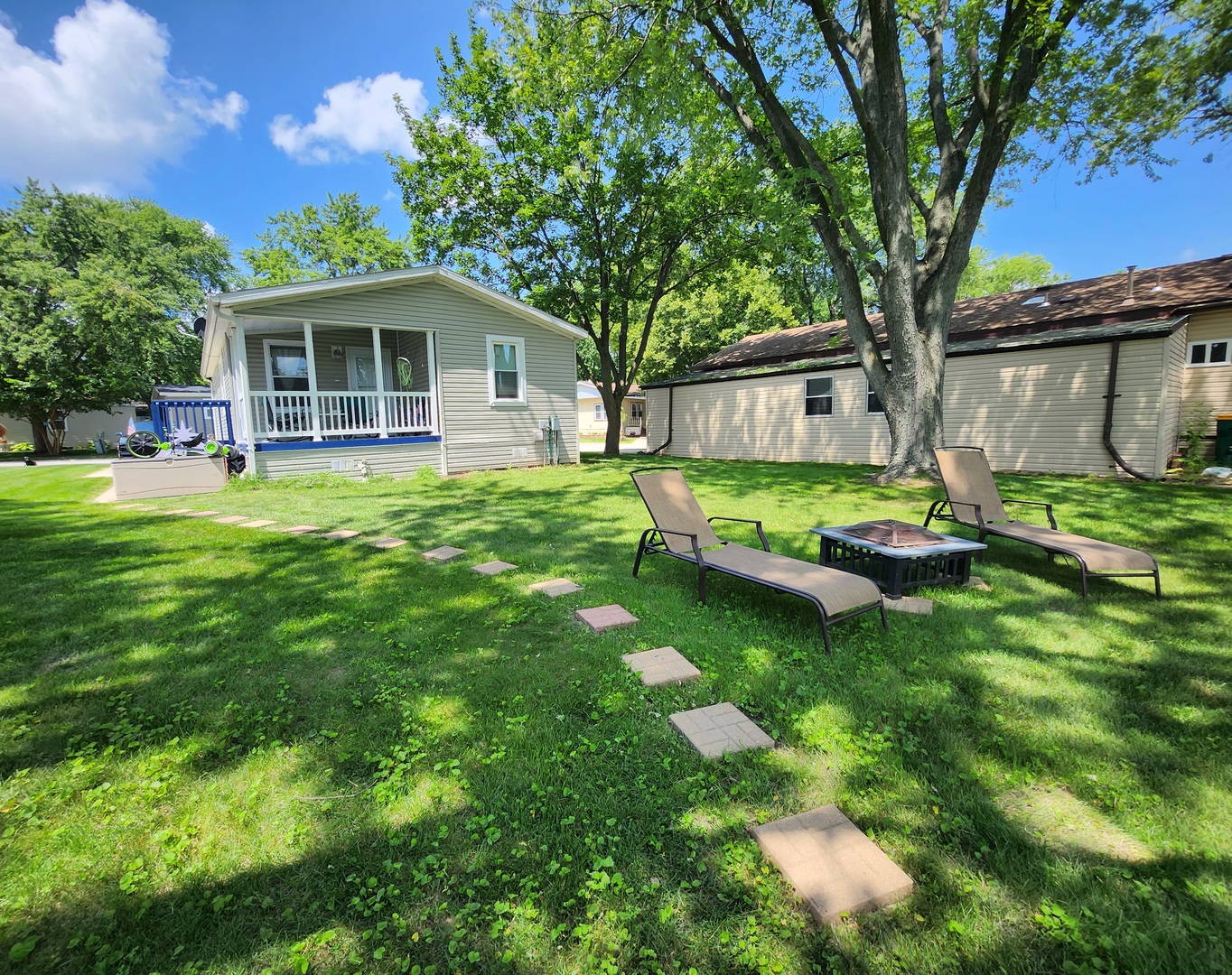 1241 Country Club Road Elgin, IL 60123 - Photo 3 of 12 a backyard of a house with table and chairs