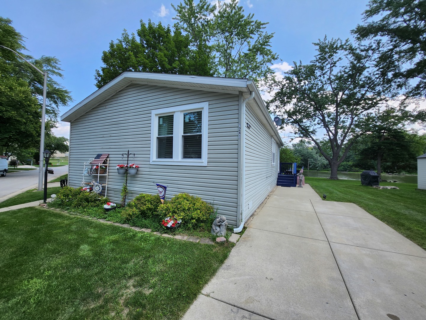 1241 Country Club Road Elgin, IL 60123 - Photo 5 of 12 a view of a house with a yard