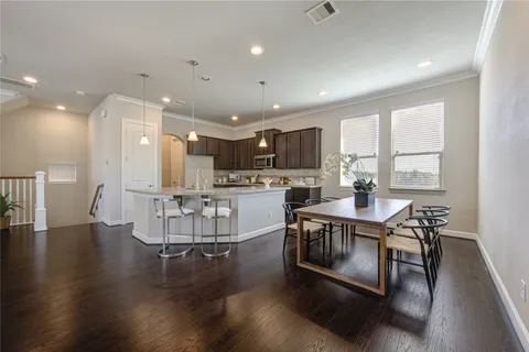 a view of kitchen with cabinets and wooden floor