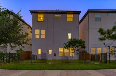 a front view of a residential apartment building with a yard