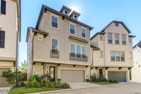 a front view of a building with garden