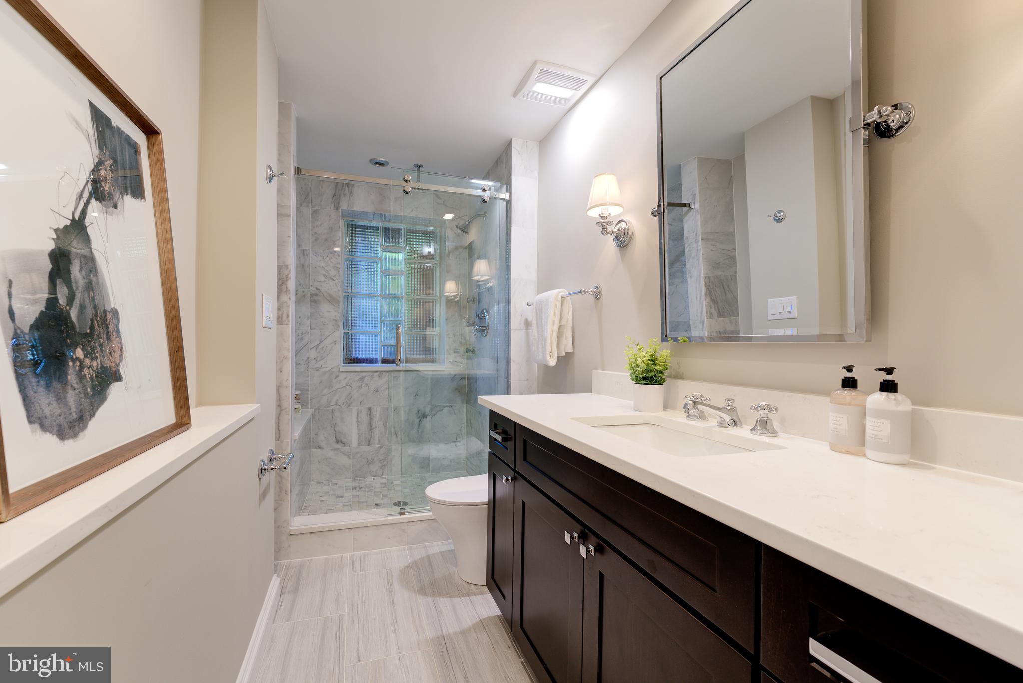 1302 R Street Northwest, Unit 1 Washington, DC 20009 - Photo 26 of 45 Marble MBA has glass shower&glass block window!