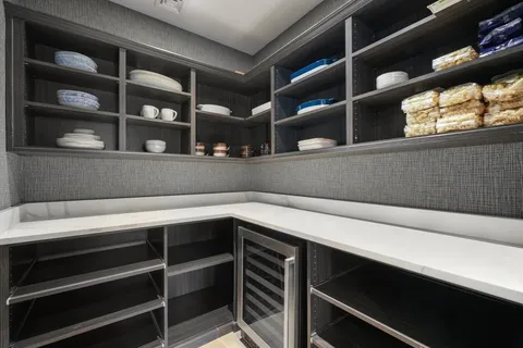 a front view of a house with a garden and yard