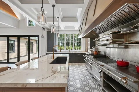 a bedroom with a large bed and a large window