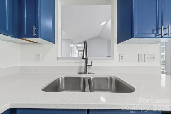 a kitchen with a sink and cabinets