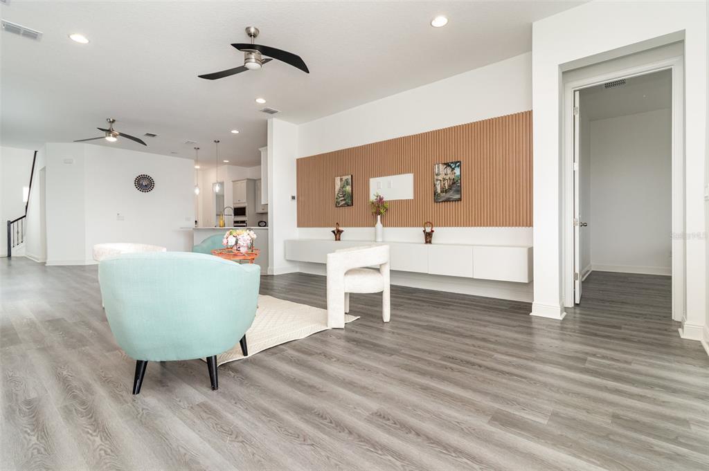 15701 Vetta Drive Montverde, FL 34756 - Photo 20 of 68 a living room with furniture and a wooden floor