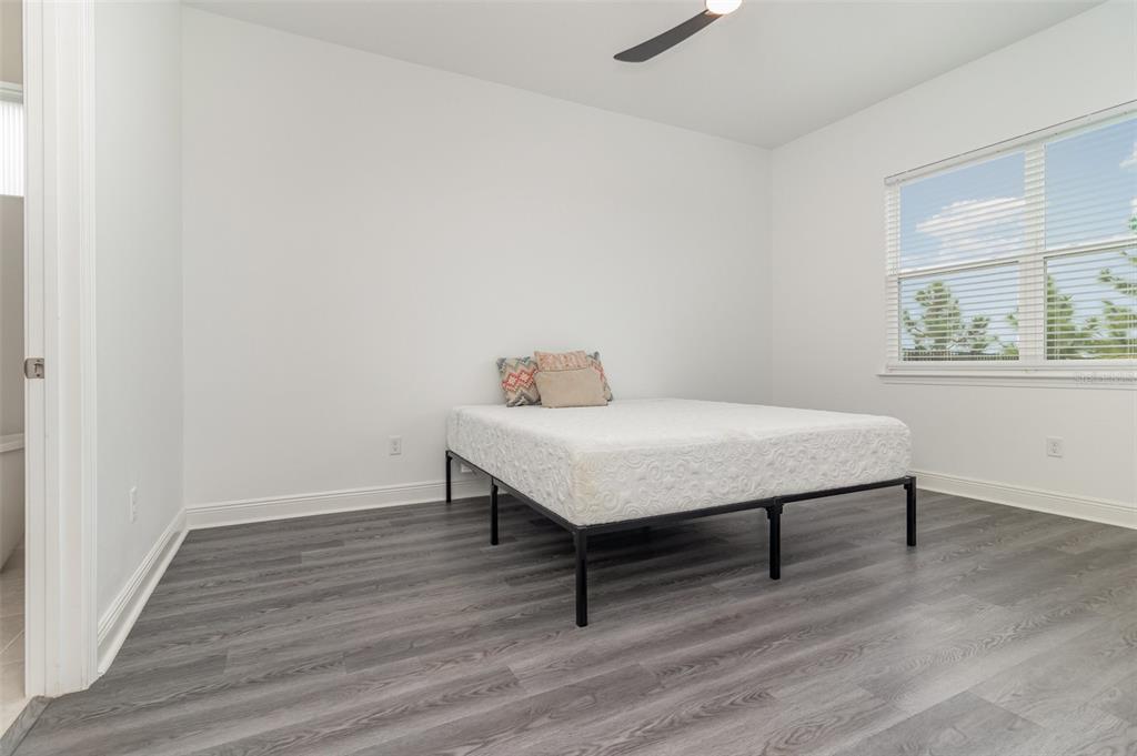 15701 Vetta Drive Montverde, FL 34756 - Photo 28 of 68 a room with a table chairs and wooden floor