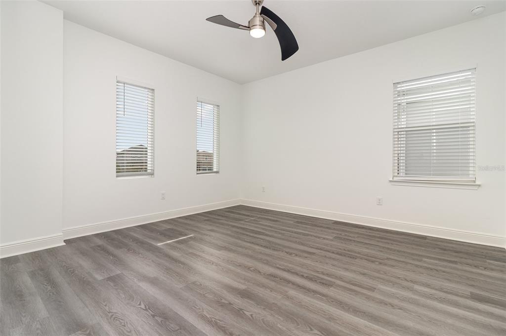 15701 Vetta Drive Montverde, FL 34756 - Photo 34 of 68 wooden floor in an empty room with a window