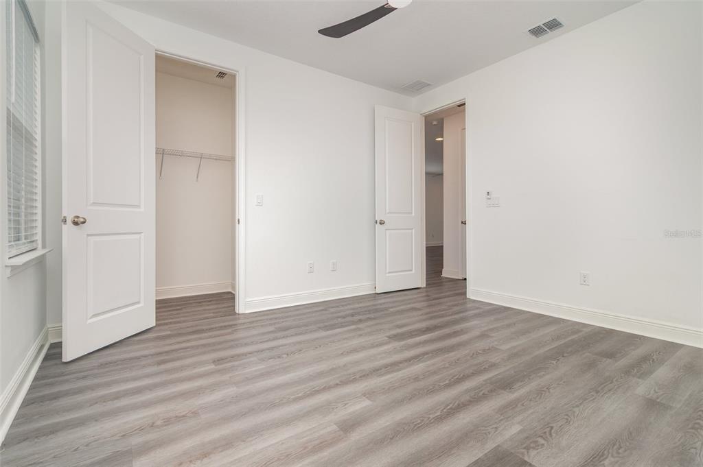 15701 Vetta Drive Montverde, FL 34756 - Photo 42 of 68 a view of an empty room with wooden floor and closet