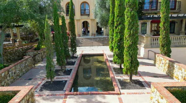 an aerial view of a house with outdoor space swimming pool