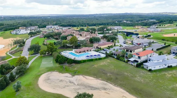 an aerial view of a house with a swimming pool