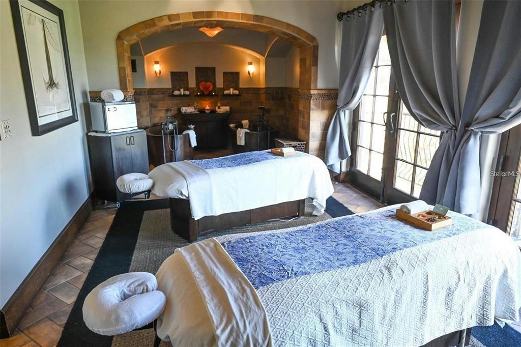 15701 Vetta Drive Montverde, FL 34756 - Photo 60 of 68 a bedroom with a bed dresser and a large mirror next to a window