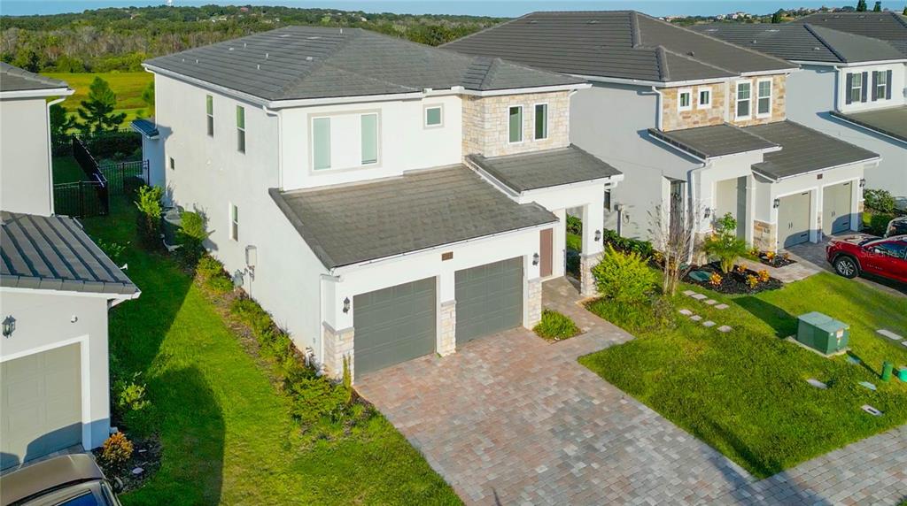 15701 Vetta Drive Montverde, FL 34756 - Photo 63 of 68 a aerial view of a house with a yard