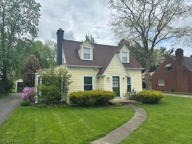 317 Ewing Road Youngstown, OH 44512 - Photo 1 of 15 New england style home with a garage and a front lawn