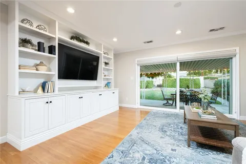 a living room with fireplace furniture and a flat screen tv