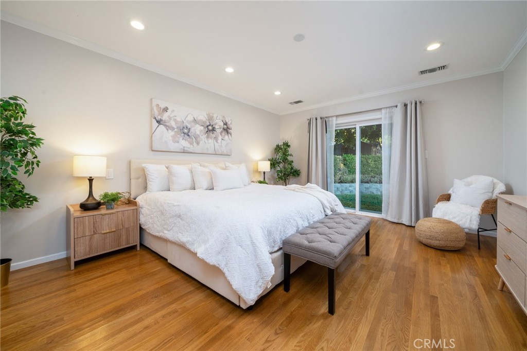 536 North Pennsylvania Avenue Glendora, CA 91741 - Photo 13 of 38 a bedroom with a bed and wooden floor