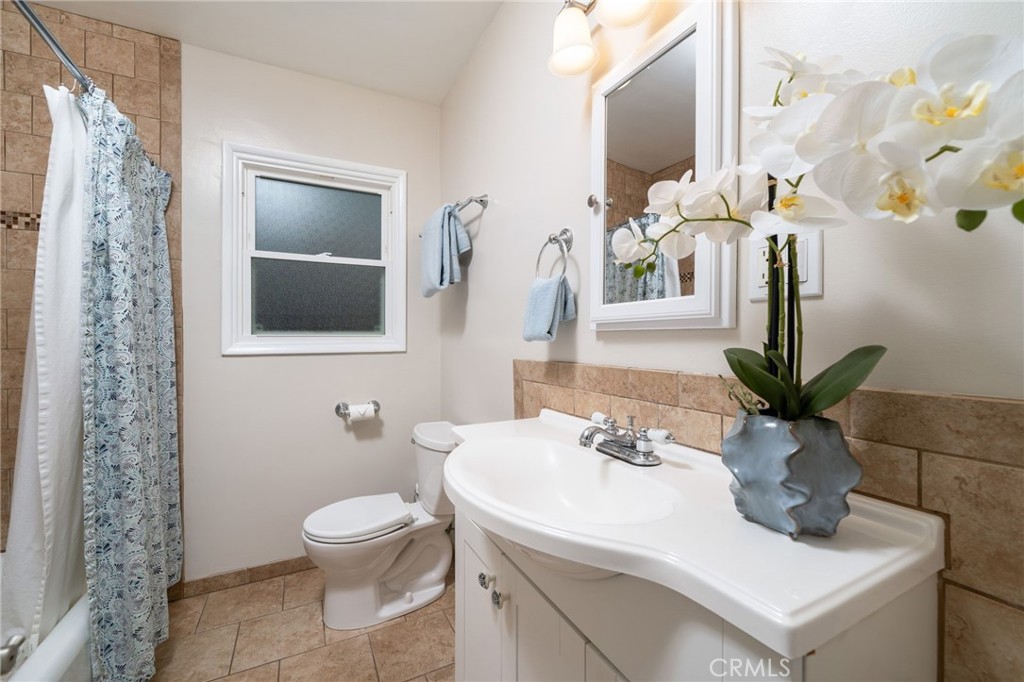 536 North Pennsylvania Avenue Glendora, CA 91741 - Photo 17 of 38 a bathroom with a toilet sink and mirror
