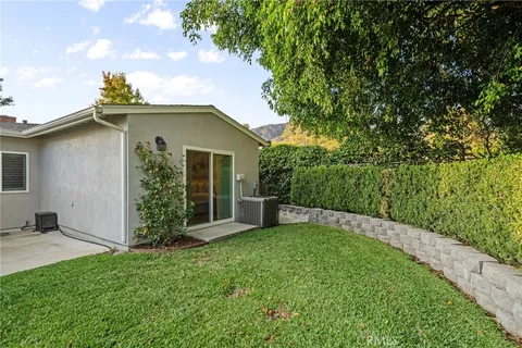 a view of a backyard of the house