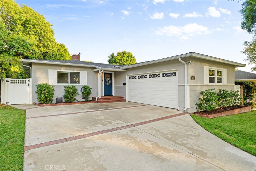 536 North Pennsylvania Avenue Glendora, CA 91741 - Photo 36 of 38 a front view of a house with a yard and potted plants