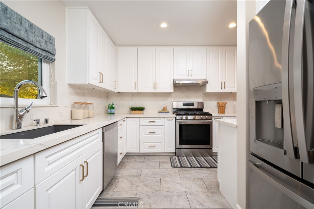 536 North Pennsylvania Avenue Glendora, CA 91741 - Photo 6 of 38 a kitchen with a sink stove and refrigerator