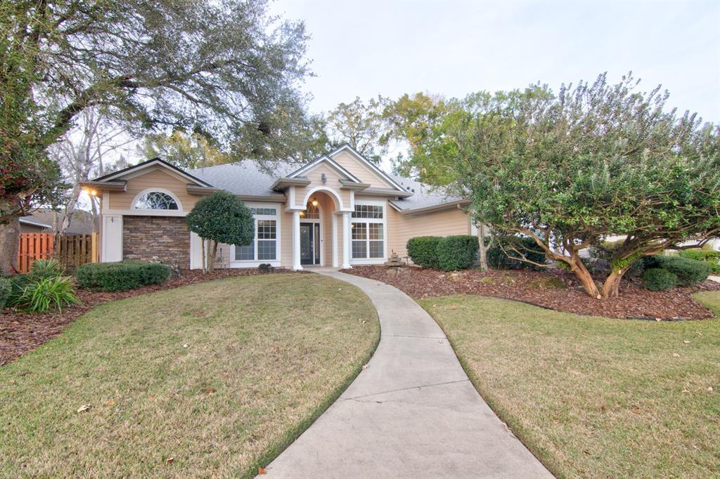 a front view of a house with garden