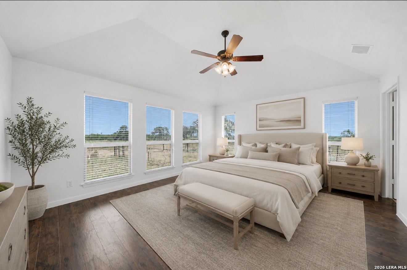 12897 La Vernia Road St. Hedwig, TX 78152 - Photo 19 of 34 a bedroom with a large bed and a window