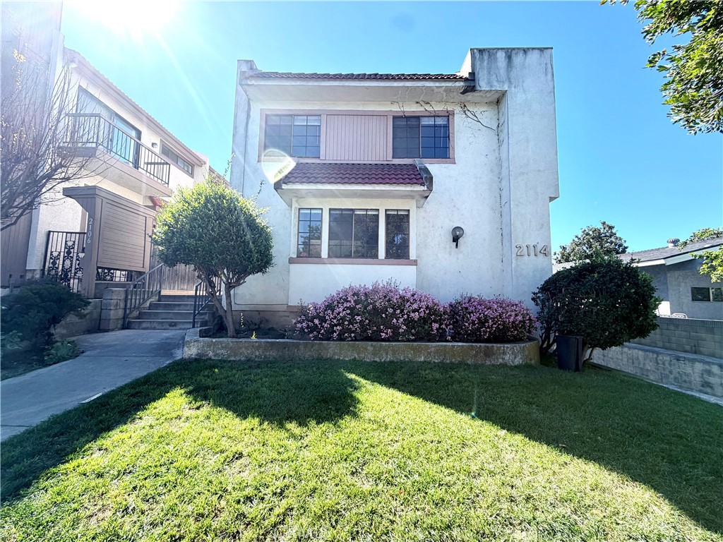 2114 Cedar Street, Unit E Alhambra, CA 91801 - Photo 1 of 13 a front view of a house with a yard
