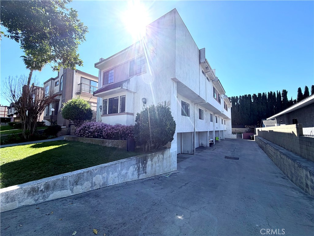 2114 Cedar Street, Unit E Alhambra, CA 91801 - Photo 13 of 13 a view of a house with a yard and plants
