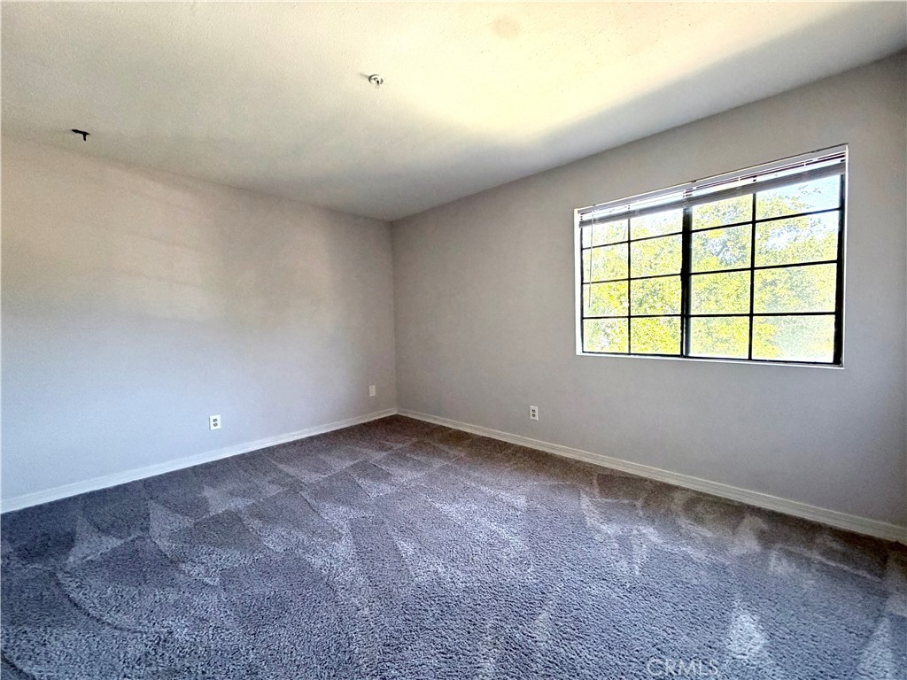 2114 Cedar Street, Unit E Alhambra, CA 91801 - Photo 7 of 13 an empty room with a window