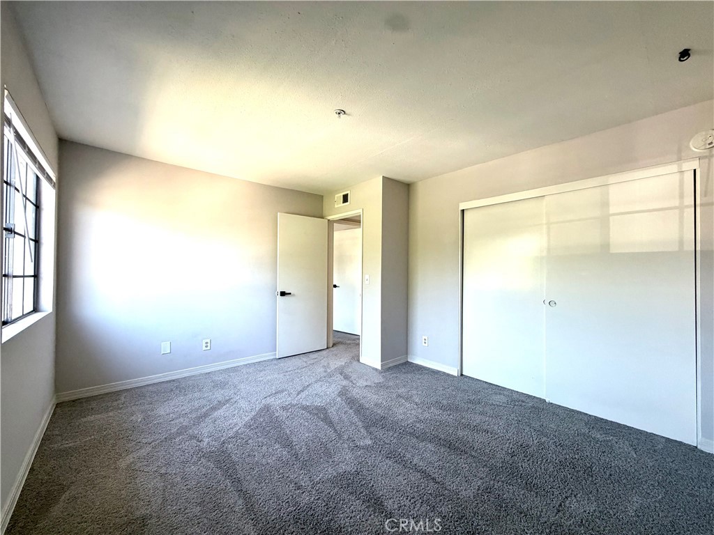 2114 Cedar Street, Unit E Alhambra, CA 91801 - Photo 8 of 13 a view of an empty room with a window