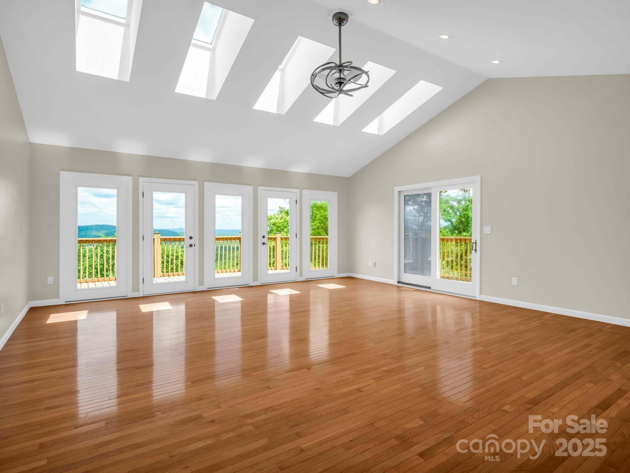 995 Towery Trace Road Ellenboro, NC 28040 - Photo 13 of 47 a view of an empty room with wooden floor and a window
