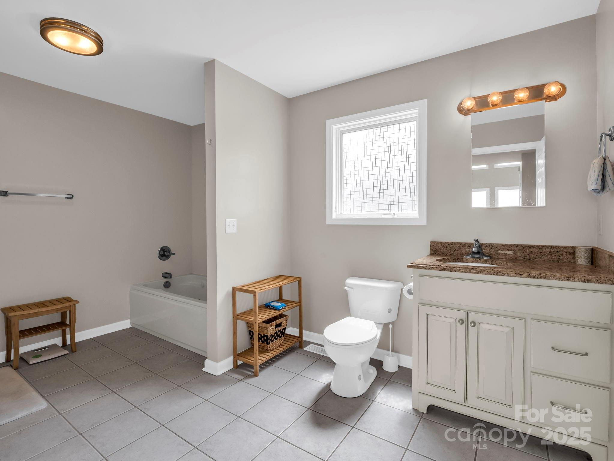 995 Towery Trace Road Ellenboro, NC 28040 - Photo 18 of 47 a bathroom with a sink a toilet and bathtub
