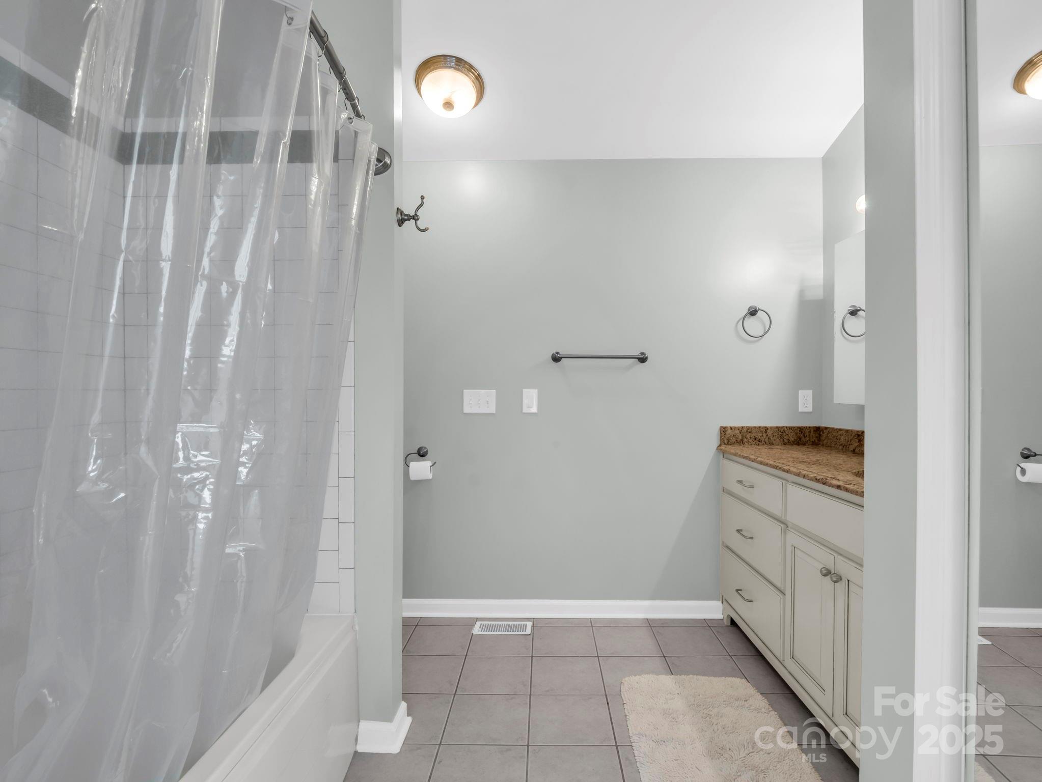 995 Towery Trace Road Ellenboro, NC 28040 - Photo 24 of 47 a bathroom with a granite countertop sink a toilet and shower