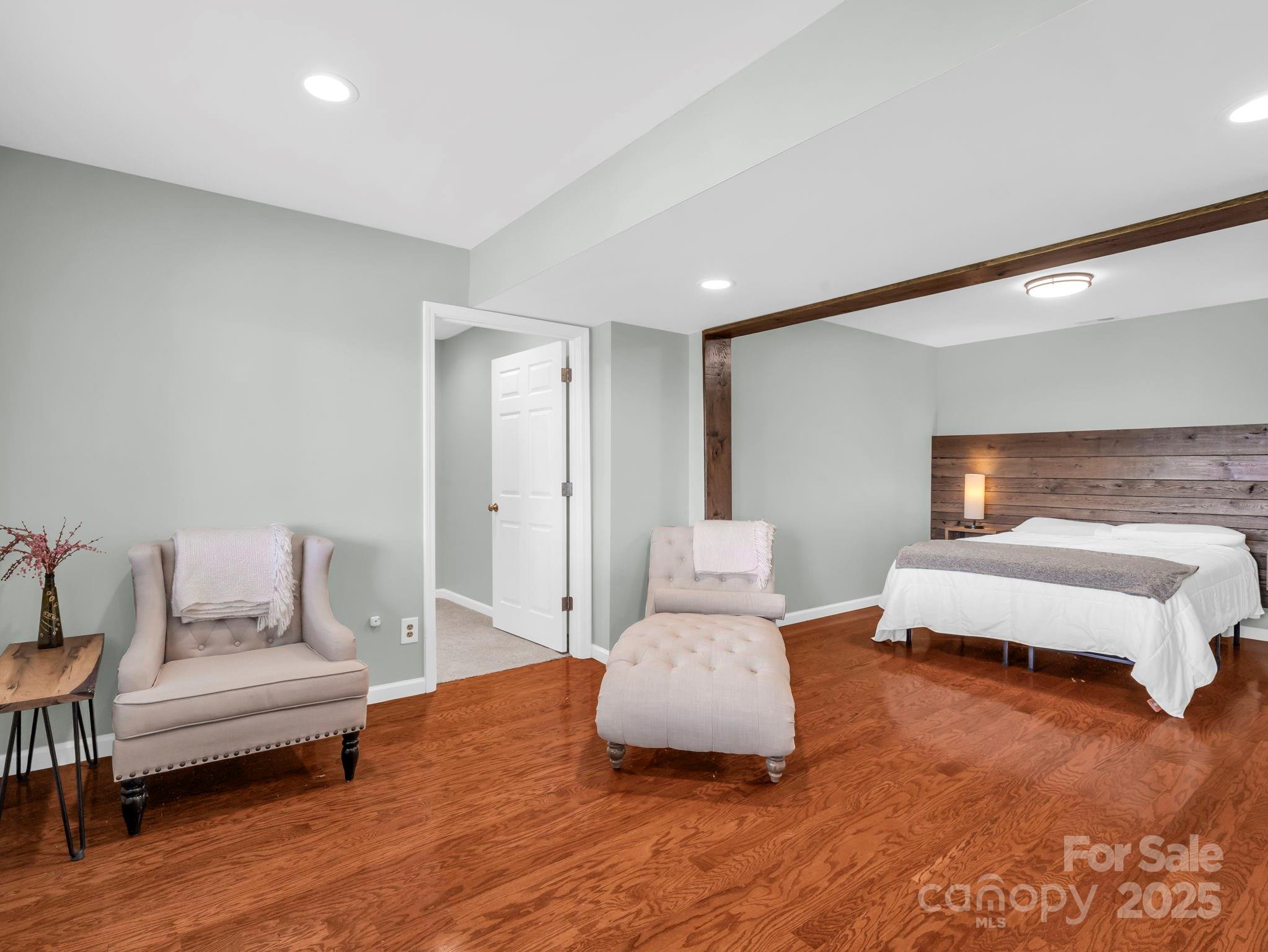 995 Towery Trace Road Ellenboro, NC 28040 - Photo 30 of 47 a bedroom with furniture and wooden floor
