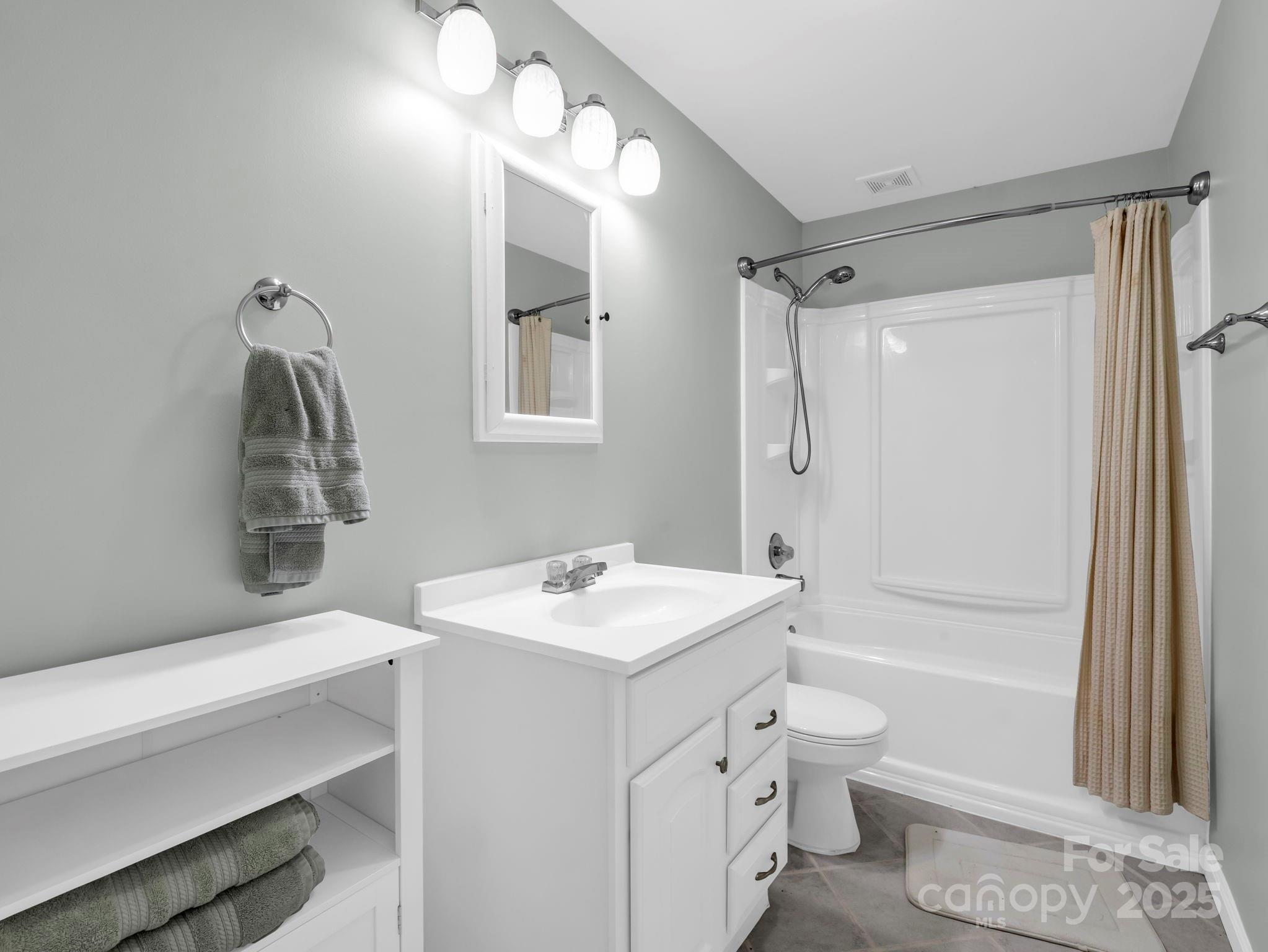 995 Towery Trace Road Ellenboro, NC 28040 - Photo 33 of 47 a bathroom with a sink a toilet and shower