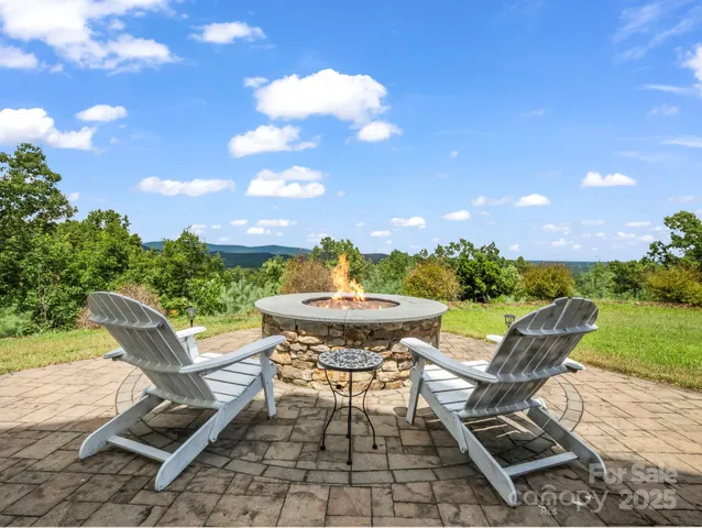 a view of a chairs and table in patio