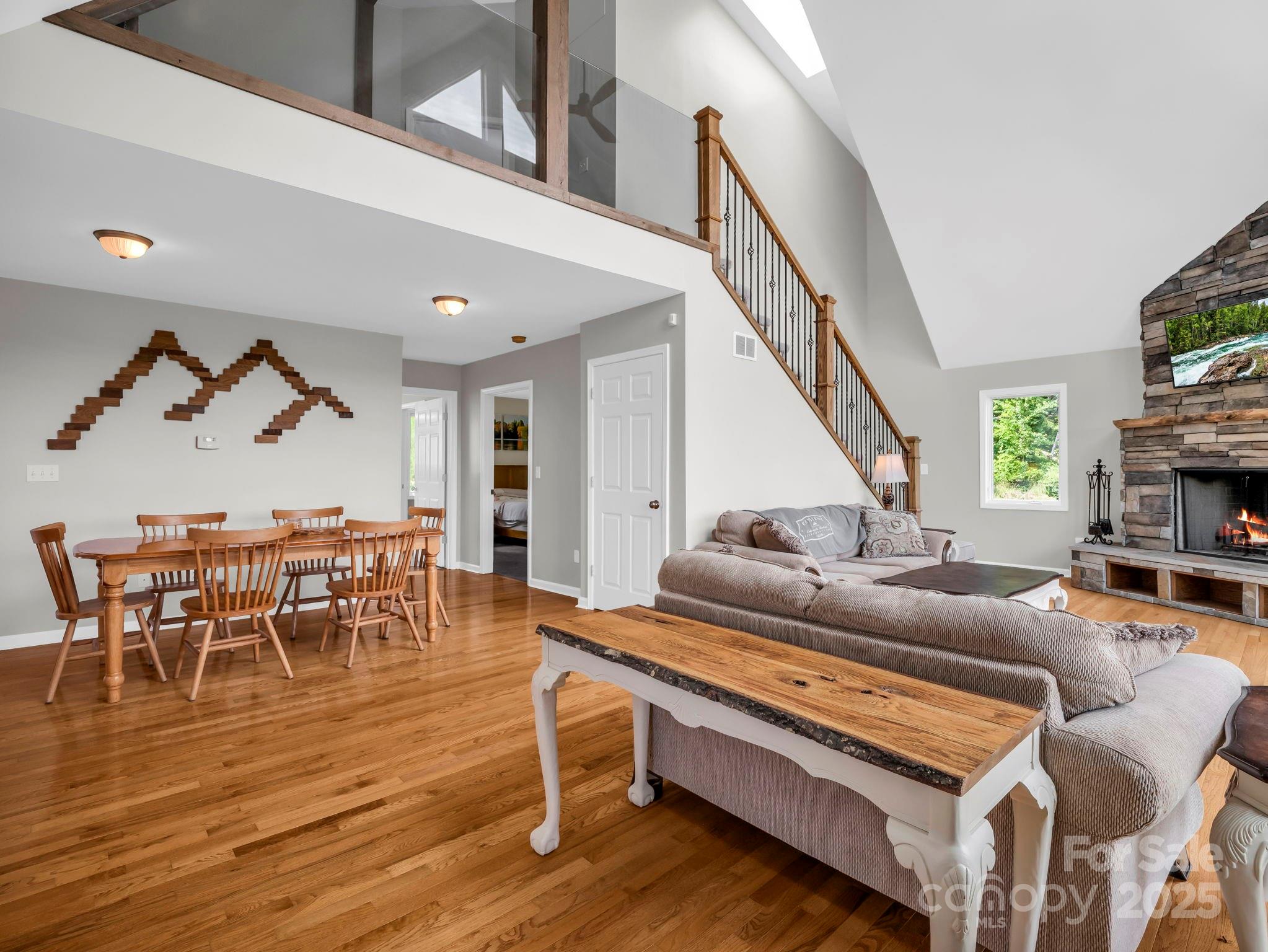 995 Towery Trace Road Ellenboro, NC 28040 - Photo 6 of 47 a living room with furniture and a dining table with wooden floor
