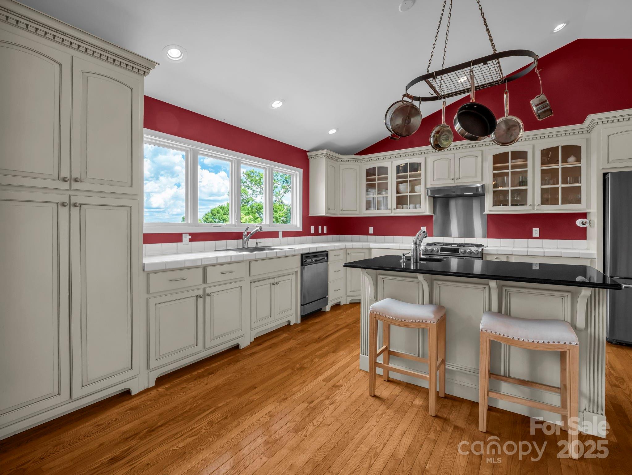995 Towery Trace Road Ellenboro, NC 28040 - Photo 10 of 47 a kitchen with a sink cabinets and wooden floor