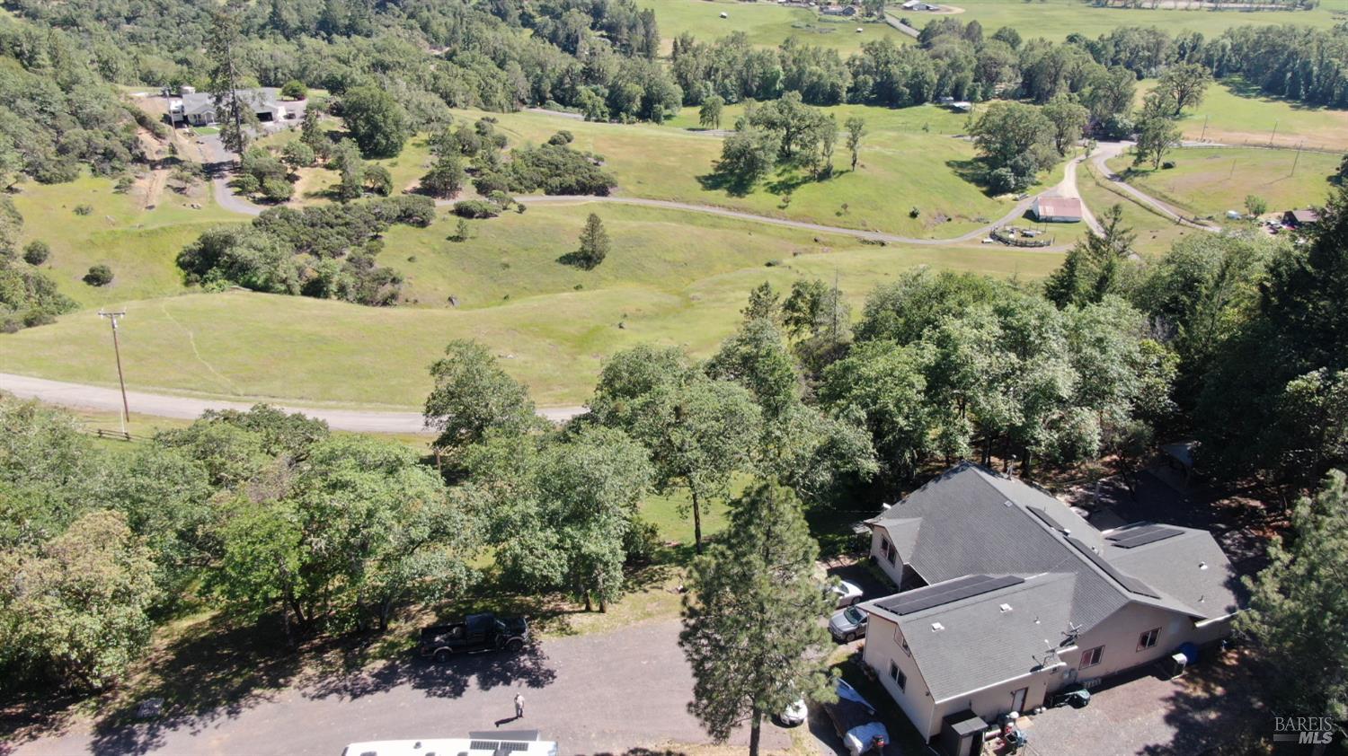 3970 Canyon Road Willits, CA 95490 - Photo 8 of 73 an aerial view of a house with a yard and lake view
