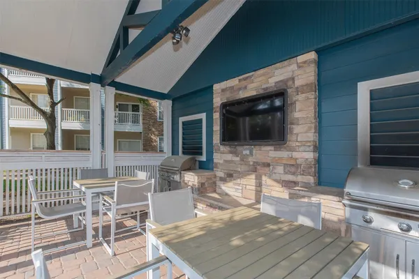 a front view of house with a garden