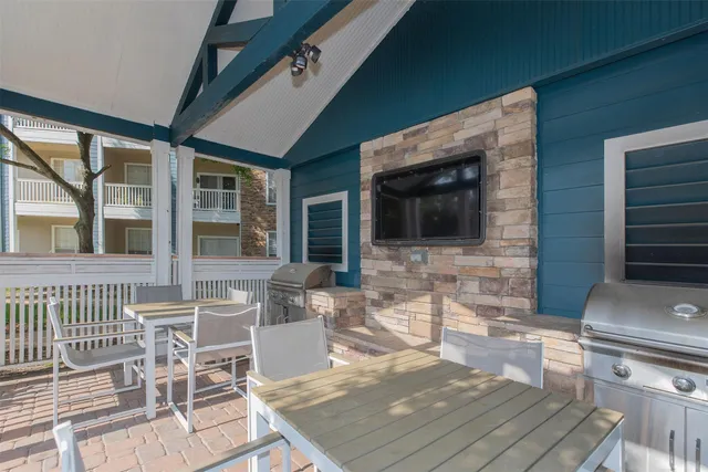 a view of a house with swimming pool and sitting area