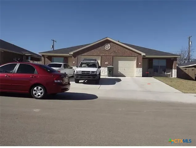 a view of a car in front of house